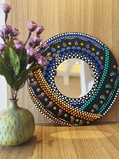 This stunning spiral dot mandala mirror was handcrafted in one of my workshops. It's a perfect example of how you can create a beautiful and functional piece of home decor, even as a beginner.