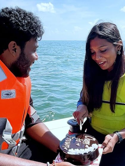 Celebrating the engagement with a cake cutting ceremony right on the yacht.