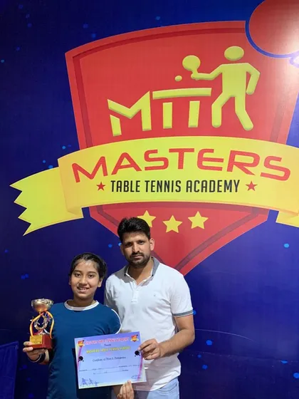 Coach Prashant with Varya after she secured a silver medal in the under 11 girls category at the Masters table tennis tournament. We celebrate every single achievement.
