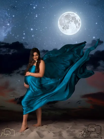 A creative masterpiece. We've edited this shot to place the mother-to-be under a magical night sky, with the moon and stars watching over her.