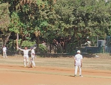 A player acknowledging the applause from the sidelines. These moments of recognition are important for a young cricketer's confidence.