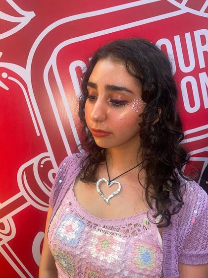 A soft pink glitter accent on the cheek. This look is subtle, sweet, and perfect for a cute, anime-inspired vibe.