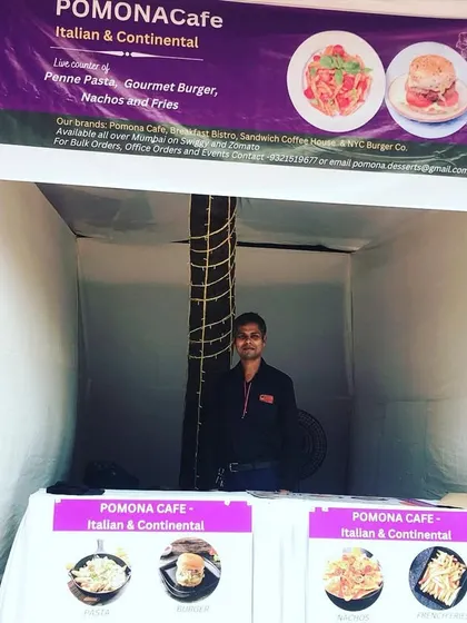 My catering stall setup for the Chembur Durga Puja festival. I offer a range of Italian and Continental dishes like pasta and gourmet burgers, bringing a unique flavour to traditional events.