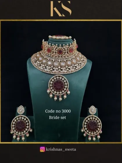 A premium quality Kundan bridal set with a unique circular pendant design. The rich red stones make it a beautiful and traditional choice for any bride.