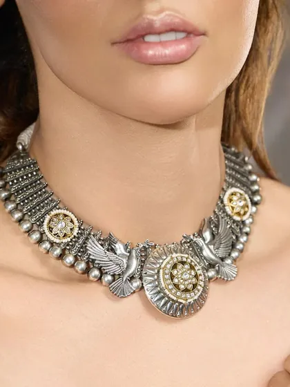 The full view of the 'Mystic Wings' choker, a unique piece that blends traditional craftsmanship with symbolic design.