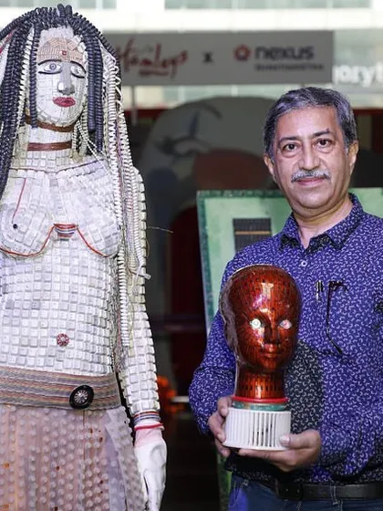 Here I am with one of my wearable art sculptures, crafted entirely from discarded keyboard keys and electronic components. This piece explores the relationship between the human form and the technology that surrounds us, turning e-waste into a statement on sustainable fashion.