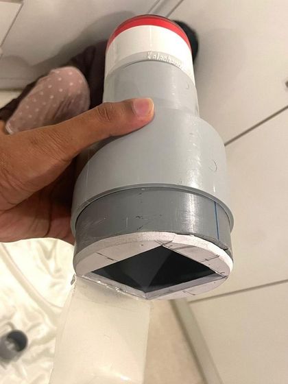 A close-up of a DIY camera built in our workshop. This ingenious device uses a simple shutter and is designed to create images on light-sensitive paper, teaching the fundamental principles of photography.