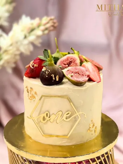 Celebrating a first birthday with this special vanilla bean and fresh fig cake. I use only premium vanilla and seasonal fresh fruits to create a flavor that is both delicate and memorable. The custom "one" topper adds a personal touch to the milestone.