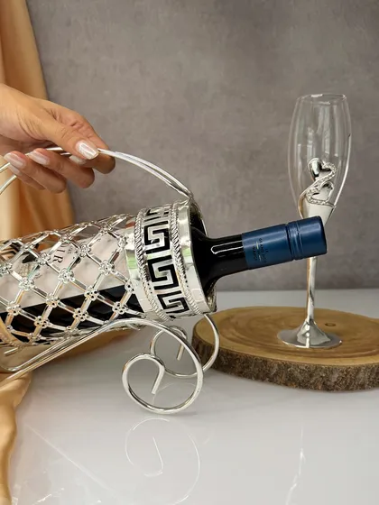 Celebrate the season in style with my exquisite wine holder. Its elegant curves and detailed design make it a perfect gift for anyone who appreciates fine living.