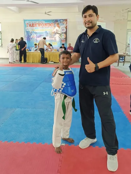 A young fighter ready for his match at the South East District Taekwondo Championship. I am there to support every student.