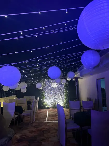We transformed this rooftop with a canopy of fairy lights and hanging paper lanterns, creating a magical and dreamy atmosphere for a birthday celebration.