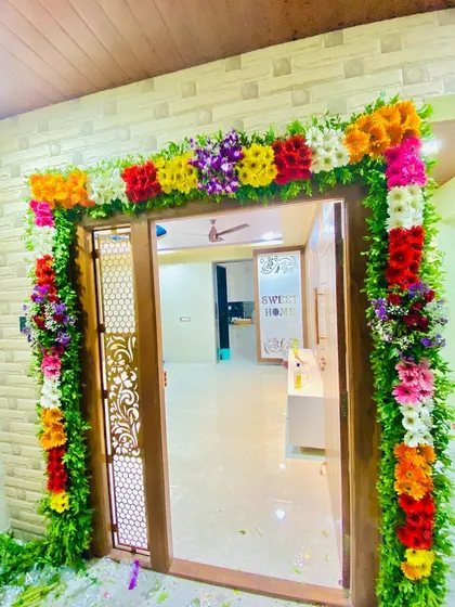 Another view of the beautiful fresh flower decoration around a home's entrance.