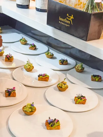 A beautiful array of canapés ready for a private event. The variety in shapes and colors promises a diverse tasting experience.