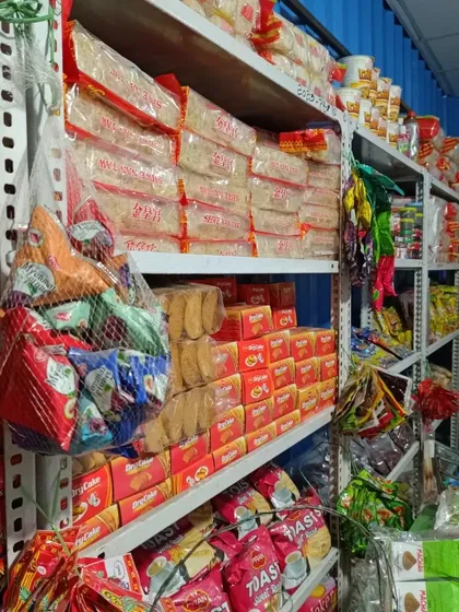 A view of my stocked shelves. You can see a variety of Asian snacks, biscuits, and instant noodles alongside the Northeast staples. I keep a full inventory of products.