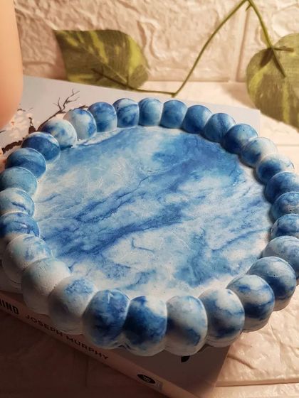 Our bubble tray in a stunning blue and white marble, reminiscent of ocean waves.