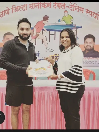 Our star player Suraj Chandrasekharan receives his certificate after winning his first gold medal in the 39+ veterans event at the Thane District Ranking tournament in Dombivali.