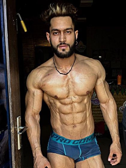 Ready for the stage. This is the kind of lean, muscular, and confident look we work to build for your competition day.