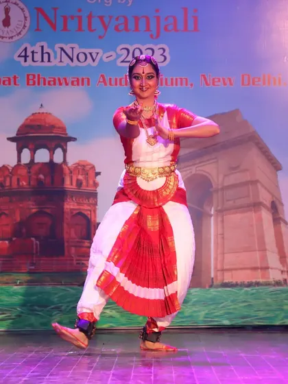 A moment of storytelling through hand gestures, or mudras. Each mudra has a specific meaning, allowing the dancer to narrate complex stories without words.