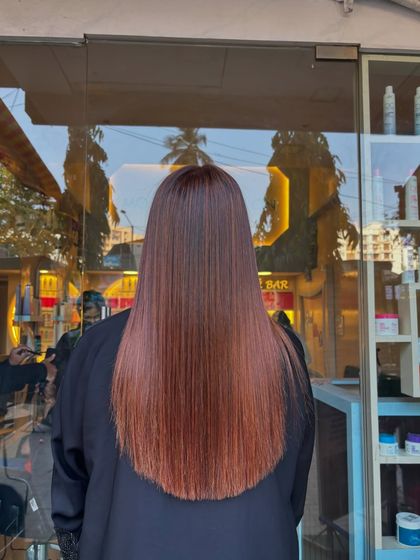 The view from the back shows the health and straightness of the hair post-coloring. My coloring process always prioritizes hair integrity, so you leave with a great color and healthy hair.