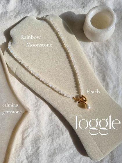 My Rainbow Moonstone toggle necklace on a display bust. This calming gemstone is perfect for enhancing creativity and inner confidence.