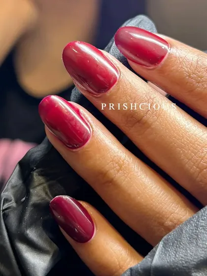 Wine-inspired nails for the win! This is a beautiful deep wine shade on temporary nail extensions, perfect for a sophisticated look.