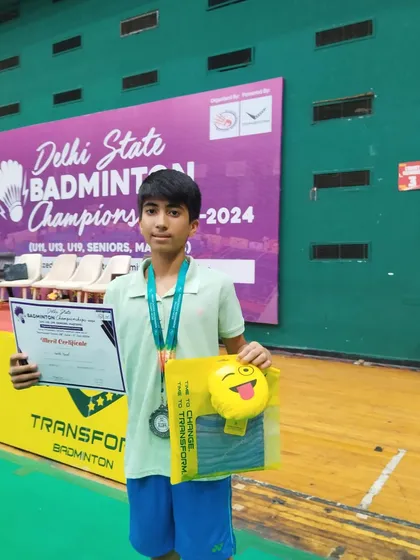 Kartik with his silver medal and certificate at the Delhi State Championships. This young athlete has a bright future ahead of him.