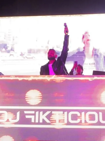 Owning the stage with my name in lights. The custom DJ console and massive VJ screen are central to my performance, ensuring my brand and visuals are front and center.
