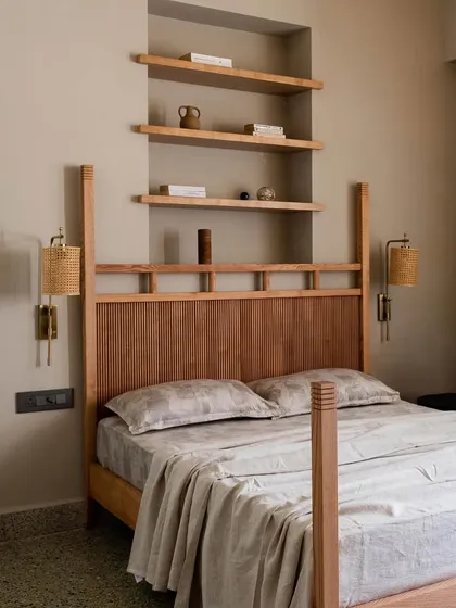 In Apartment 5026, we honored the home's Art Deco heritage with contemporary touches. This bedroom features a custom four-poster bed and reclaimed terrazzo flooring, blending timeless design with authentic Mumbai character.