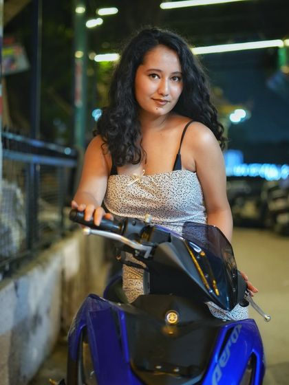 A cool, edgy portrait with a scooter as a prop. This shot adds a bit of urban attitude and is great for creating unique social media content.