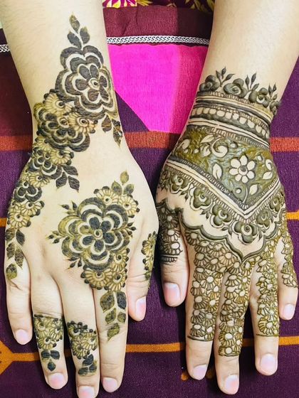 Another example of a beautiful, mismatched design. One hand features a bold floral pattern, while the other has a more traditional, filled-in look, showing my versatility.