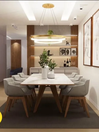 A front view of the modern dining area, highlighting the ring chandelier and the built-in crockery unit. The design is both functional and visually striking.