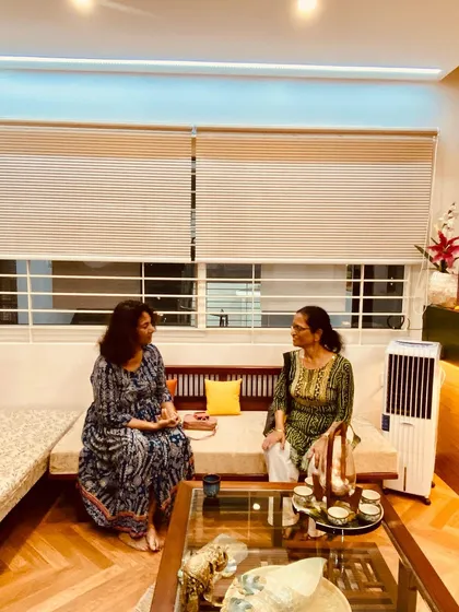 In conversation with a client in our waiting lounge. I always make time to personally connect and understand their needs.