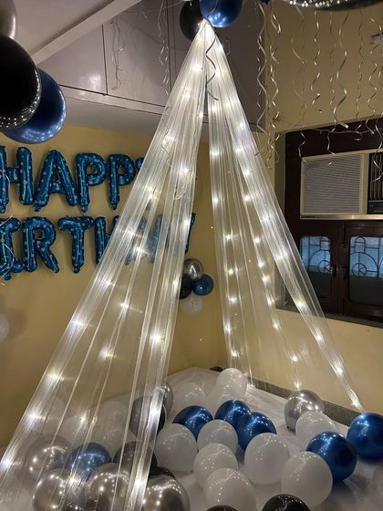 This view shows how the fairy lights on the canopy create a warm and inviting glow, making the surprise even more special.