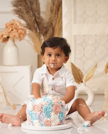 This is what pure joy looks like! I absolutely love seeing little ones enjoy their first taste of cake. I design my smash cakes to be soft, delicious, and perfect for creating these priceless, messy memories.