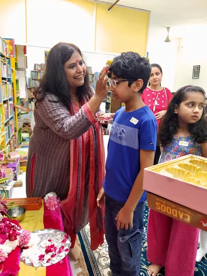 Another young reader receives a blessing during the Ganesh Chaturthi event. These moments of personal connection are at the heart of what we do.