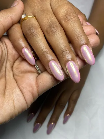 A different angle of the unicorn chrome nails, showing how the light catches the iridescent finish.