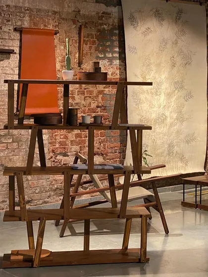 A collection of wooden furniture and textile art from the 'Intersection' exhibit. Our curation brought together the work of various artists and designers to explore the space between objects and art.
