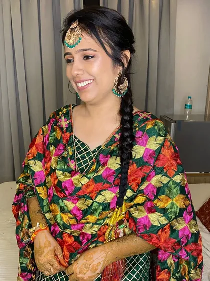 A happy smile from my Punjabi bride. The makeup is fresh and radiant, perfect for the energetic and joyful Jago ceremony.