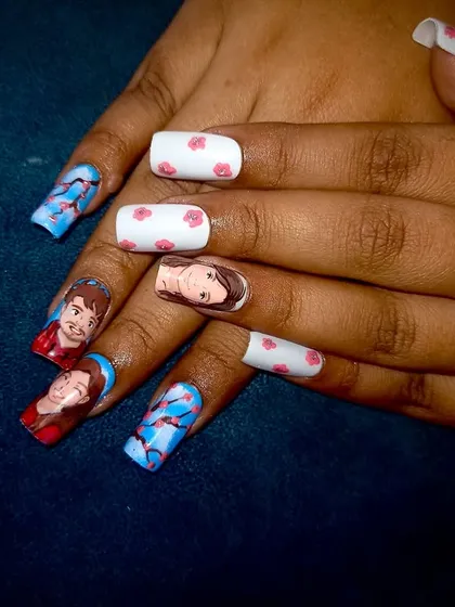 Both hands together, displaying the full Ghibli couple portrait nail art.