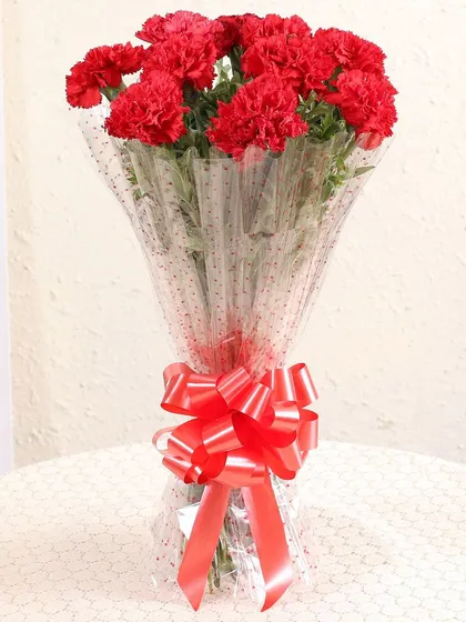 Simple, elegant, and full of charm, this bouquet of fresh red carnations is a wonderful way to show appreciation or affection. It's a beautiful and affordable option that I can deliver on the same day across Delhi NCR.