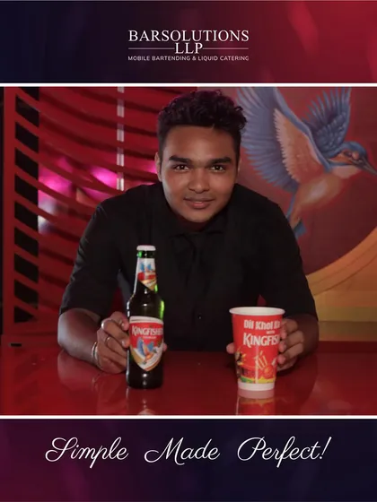 One of our professional mixologists at a Kingfisher bar, showcasing the artistry and creativity we bring to every event.