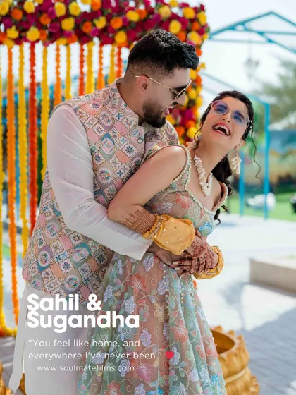 A beautiful poster-style image from a Haldi ceremony. The quote, "You feel like home, and everywhere I've never been," perfectly captures the essence of finding your soulmate. The candid laughter makes this shot special.