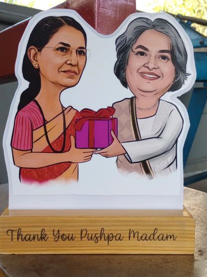 A 'Thank You' gift for Pushpa Madam, featuring her caricature on a wooden standee. It's a memorable way to show appreciation.