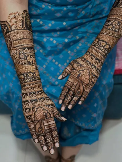 A different angle of the same bridal mehendi, highlighting the details on the palms.