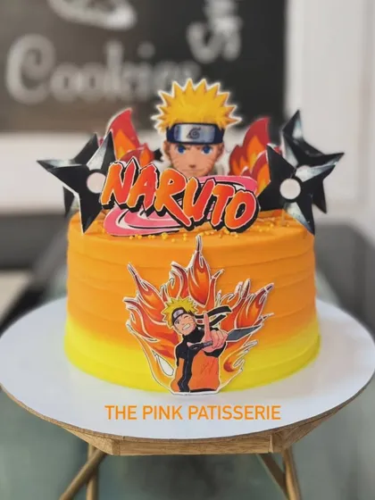 Believe it! A vibrant orange Naruto-themed cake for an anime fan. The design is packed with action, featuring character cutouts and fiery details.