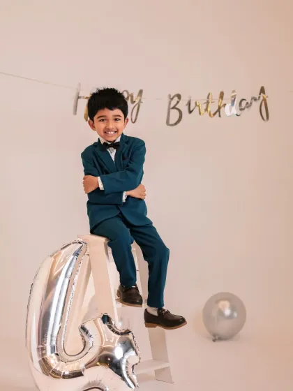 Looking sharp for his fourth birthday. This little gentleman is all smiles in his suit, showing that we cater to birthday shoots for toddlers and young children.