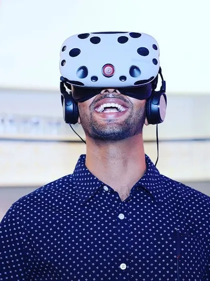 The pure joy of virtual reality. This close-up on a guest wearing an HTC Vive headset captures the immersive and exhilarating feeling my experiences deliver, turning any event into something unforgettable.