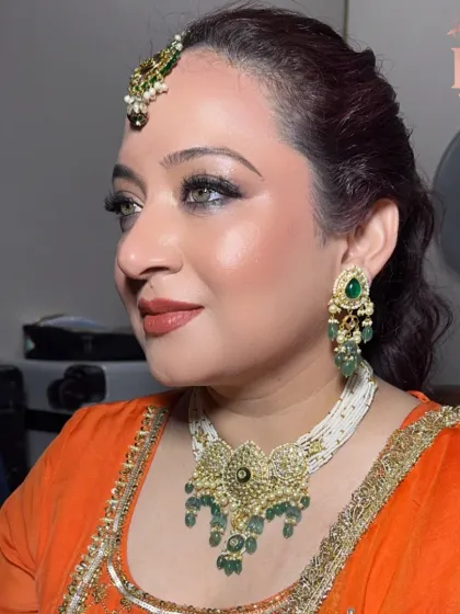 Another angle of this beautiful party makeup, showing how the look comes together with her traditional jewelry and outfit.