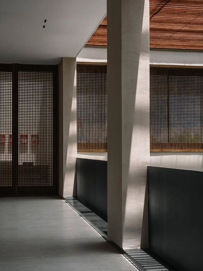 Another view of the light-filled passage, where the architecture itself becomes a canvas for the sun. The design creates a dynamic experience that changes throughout the day.