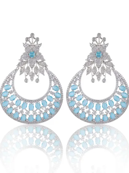 A clean, professional e-commerce photo of diamond and stone earrings. The focus here is on sharp detail, accurate color, and a subtle reflection to create a high-end look for online catalogs.